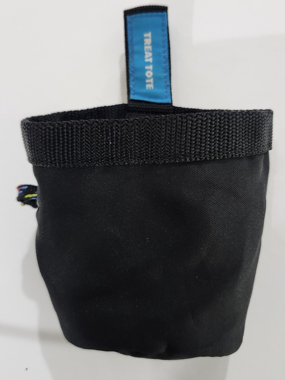 Chuckit! Black Nylon Treat Tote featuring a blue "TREAT TOTE" tag